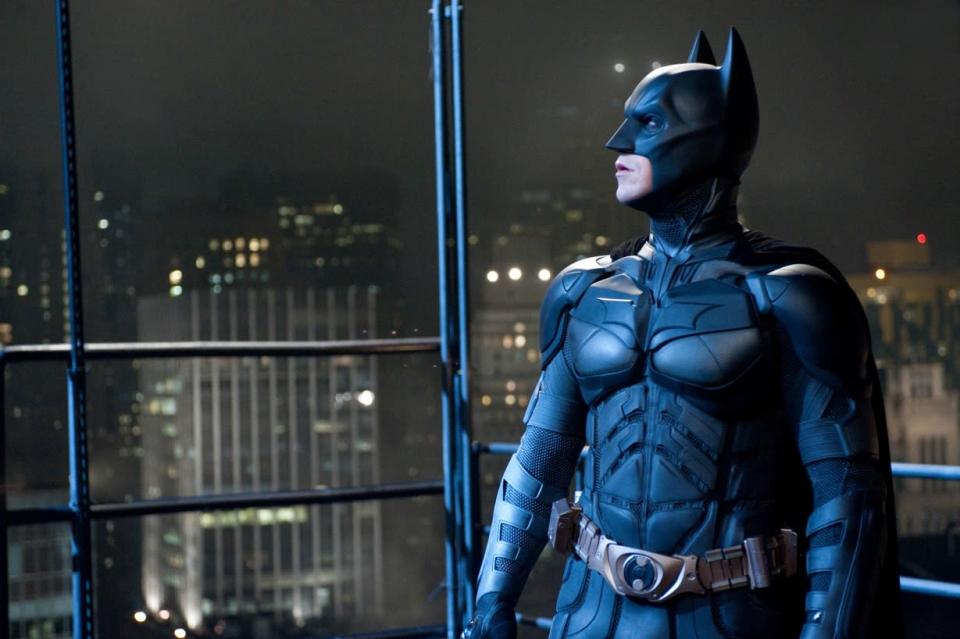 The Batsuit: From heroes to villains, the costumes have been an integral part of bringing the characters of the Dark Knight trilogy to life, starting, of course, with the indelible silhouette of Batman. Following ‘Batman Begins’ the Batsuit was significantly redesigned for “The Dark Knight,” resulting in improved comfort and flexibility, especially in the neck and shoulders. As the saying goes, ‘If it ain’t broke, don’t fix it’ so costume designer Lindy Hemming and her team made no changes to the suit for ‘The Dark Knight Rises’. The multi-layered Batsuit was comprised of 110 separate pieces, each of which had to be replicated dozens of times over the course of the production. The base layer was made of a polyester mesh that is utilized by the military and high-tech sports manufacturers because of its breathability and moisture-wicking properties. Individually molded pieces of flexible urethane were then attached to the mesh, forming the overall body armor plating. Adding another level of protection, light but strong carbon fiber panels were placed inside the sections on the legs, chest and abdomen. The cowl was sculpted from a cast of Bale’s face and head and then molded for a perfect fit. There were also ten different versions of the iconic cape, ranging in length and shape—from shorter ones, used in action scenes, to the glider cape that snaps into the shape of spread batwings.