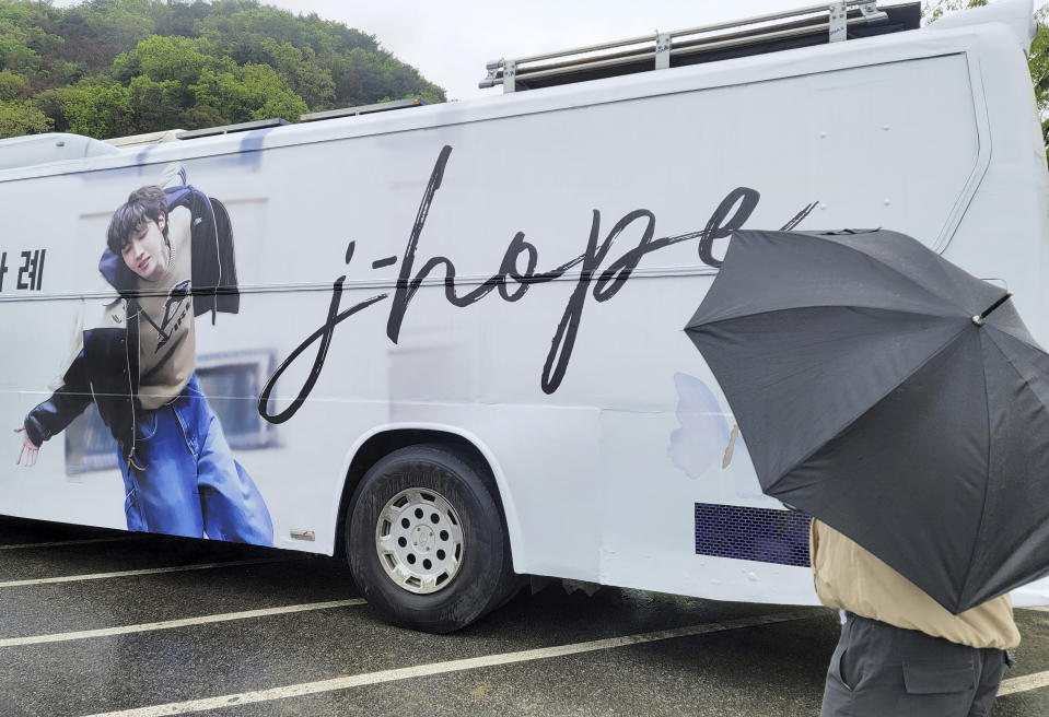 A picture of J-Hope, a member of South Korean K-pop band BTS, is seen on a bus, prepared by his fans, near a military boot camp in Wonju, South Korea, Tuesday, April 18, 2023. J-Hope entered a South Korean boot camp Tuesday, April 18, 2023 to start his 18-month compulsory military service, becoming the group’s second member to join the country's army. (Yang Ji-woong/Yonhap via AP)