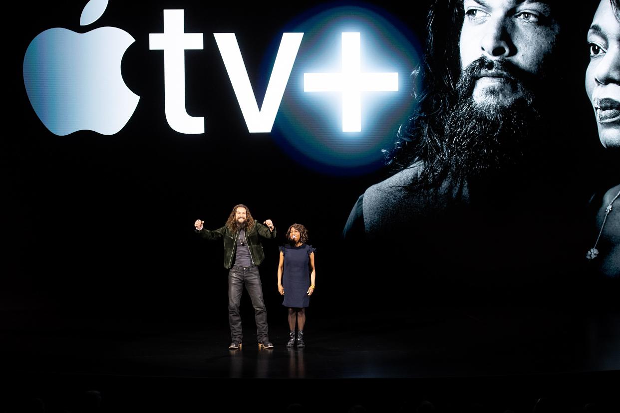 Actors Jason Momoa and Alfre Woodard speak during an event launching Apple tv+ at Apple headquarters on March 25, 2019, in Cupertino, California. (Photo by NOAH BERGER / AFP)        (Photo credit should read NOAH BERGER/AFP/Getty Images)