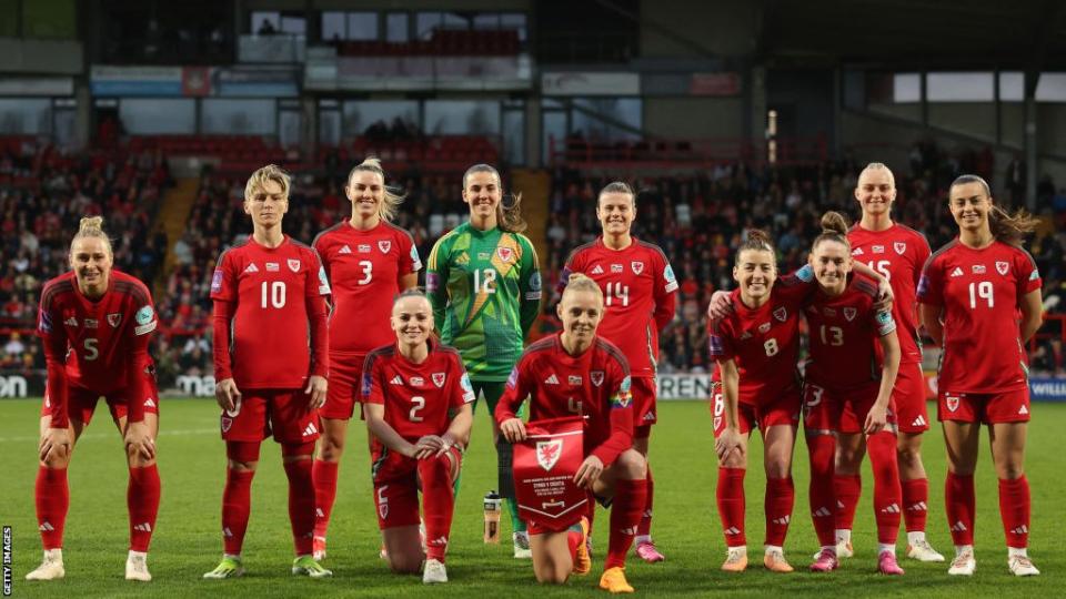 Wales Women stand in line