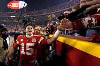 Kansas City Chiefs quarterback Patrick Mahomes (15) celebrates with fans after an NFL divisional round football game against the Buffalo Bills, Sunday, Jan. 23, 2022, in Kansas City, Mo. The Chiefs won 42-36 in overtime. (AP Photo/Charlie Riedel)