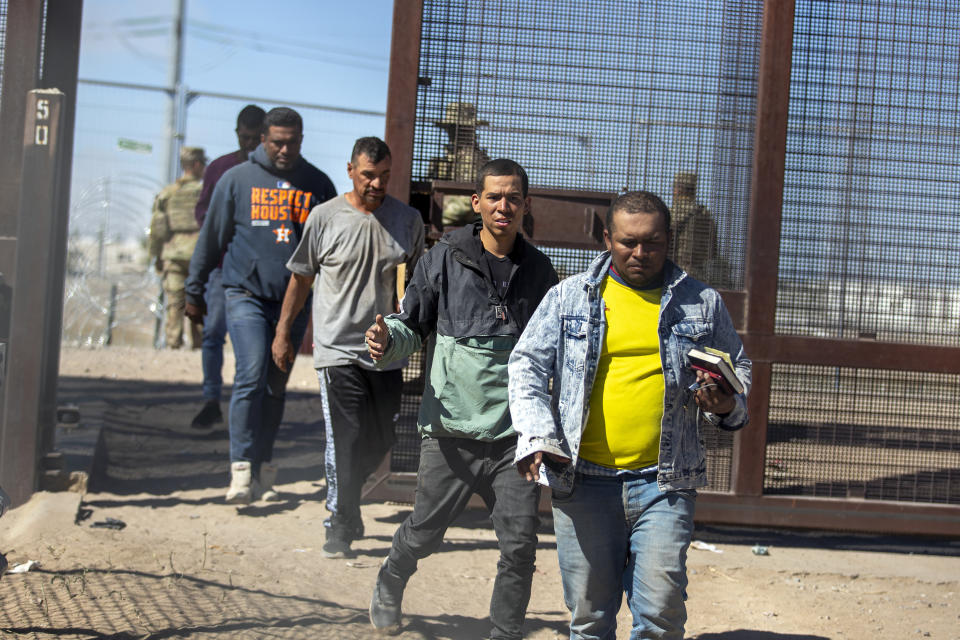 Migrants enter into El Paso, Texas from Ciudad Juarez, Mexico to be processed by immigration authorities, Wednesday, May 10, 2023. The U.S. on May 11 will begin denying asylum to migrants who show up at the U.S.-Mexico border without first applying online or seeking protection in a country they passed through, according to a new rule released May 10. (AP Photo/Andres Leighton)