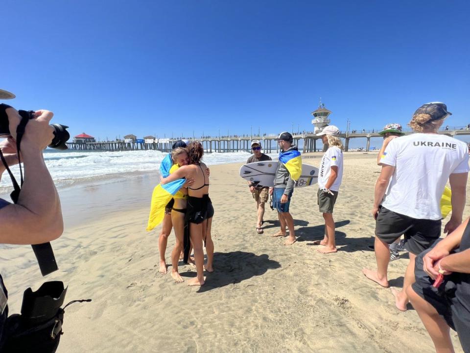 Anastasiia Temirbek emerges from the water Sept. 19, 2022, at the International Surfing Association World Surfing Games in Huntington Beach, Calif.