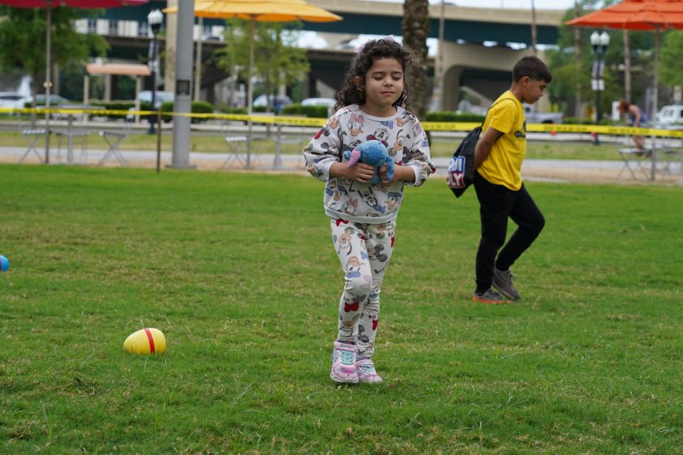 Firefighters with the Orlando Fire Department helped children with an Easter egg hunt.