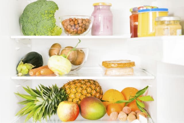 fridge filled with mostly vegetables and fruit, some soy products too.