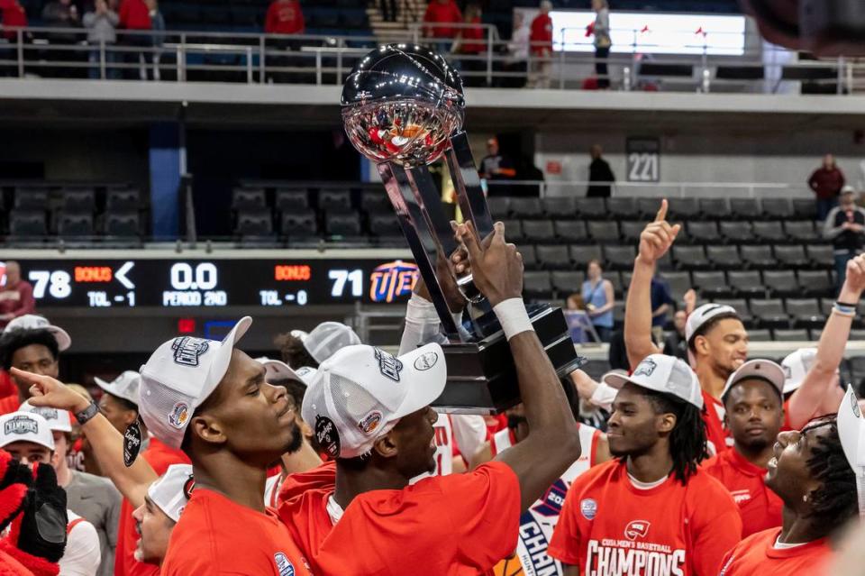 Western Kentucky celebrates a 78-71 win against UTEP in the championship of the Conference USA Tournament on Saturday night.