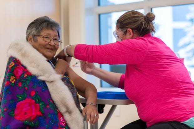 In January, Agnes Mills was the first person in Yukon to receive the COVID-19 vaccine. As of Monday, 27,153 people in the territory, or 76 per cent of the eligible adult population, had received at least their first shot. (Mark Kelly Photography/Government of Yukon - image credit)