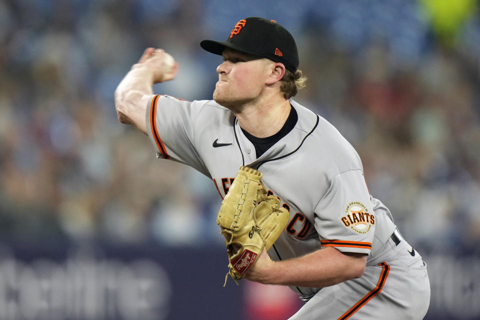 San Francisco Giants starting pitcher Logan Webb works against the Toronto Blue Jays during the first inning of a baseball game Wednesday, June 28, 2023, in Toronto. (Frank Gunn/The Canadian Press via AP)