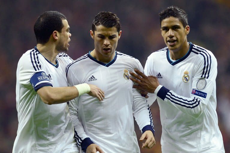 (L-R) Real Madrid's Pepe, Cristiano Ronaldo and Raphael Varane are pictured during a Champions League match in Istanbul on April 9, 2013. Varane has said Real will need to contain Dortmund's counter-attacking instincts as well as the Germans' counter-pressing game