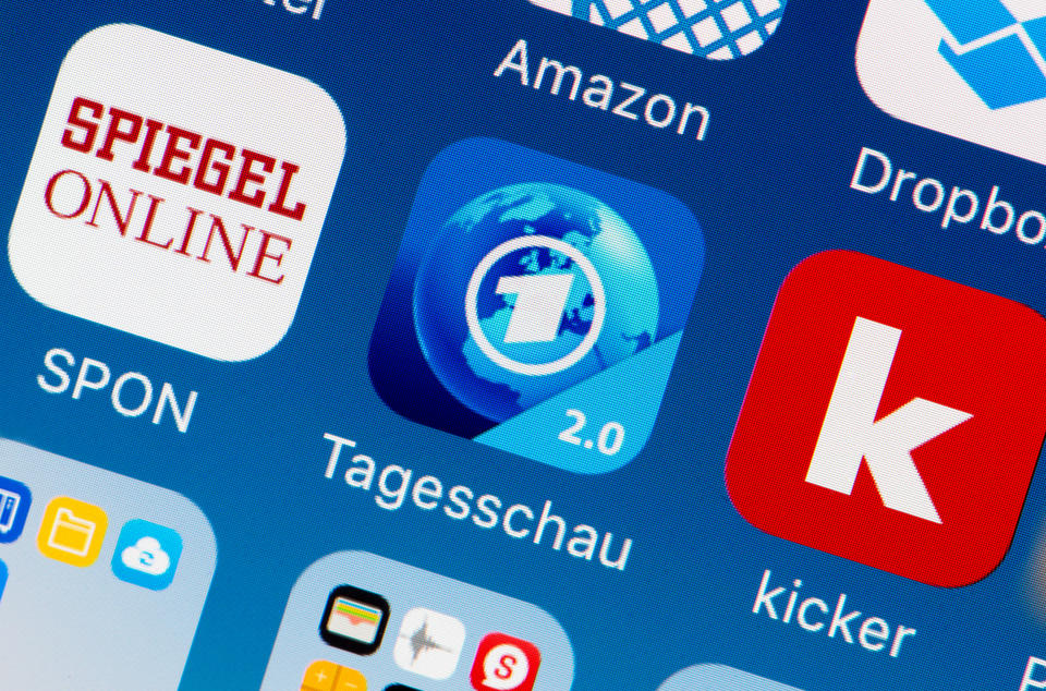 The icon of the new Tagesschau news app can be seen on a smartphone in Hamburg, Germany, 14 December 2016. The newly designed app of the German public broadcasting news show presents videos in upright format. Photo: Daniel Reinhardt/dpa | usage worldwide   (Photo by Daniel Reinhardt/picture alliance via Getty Images)