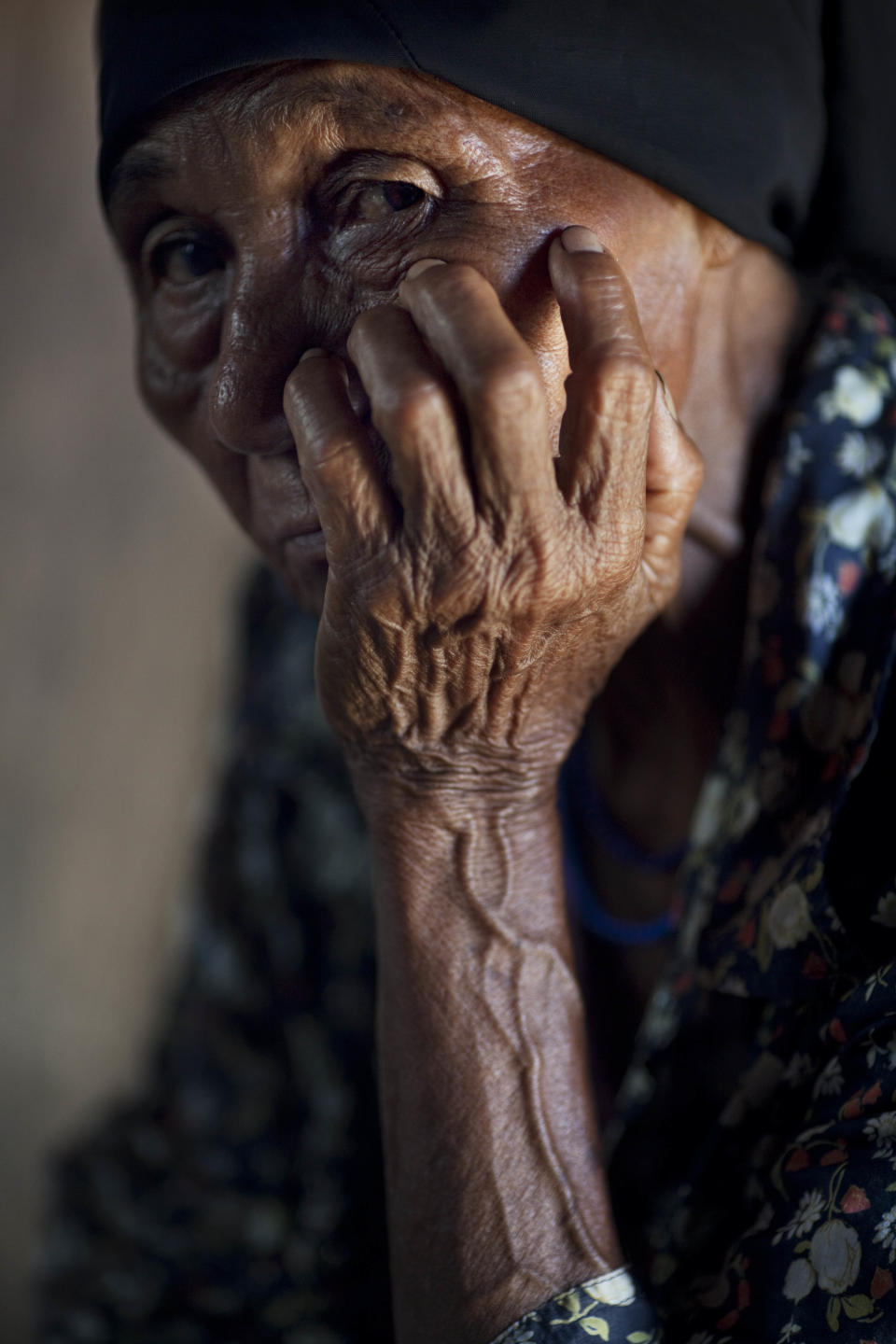 Rosela Zelaya Valderramoi, 70, rests inside her house in the Paptalaya pier, where helicopters of a joint Honduran-U.S. drug raid landed last Friday, in Ahuas, Mosquitia region, Honduras, Monday, May 21, 2012. On Friday May 11, a helicopter mission with advisers from the DEA, appears to have mistakenly targeted civilians in the remote jungle area, killing four riverboat passengers and injuring four others. Later, according to villagers, Honduran police narcotics forces and men speaking English spent hours searching the small town of Ahuas for a suspected drug trafficker.(AP Photo/Rodrigo Abd)