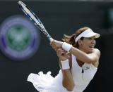 Garbine Muguruza of Spain hits a shot during her match against Timea Bacsinszky of Switzerland at the Wimbledon Tennis Championships in London, July 7, 2015. REUTERS/Henry Browne