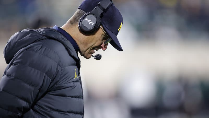 Michigan coach Jim Harbaugh reacts during game against Michigan State, Saturday, Oct. 21, 2023, in East Lansing, Mich. Harbaugh is under fire amid a sign-stealing scandal.