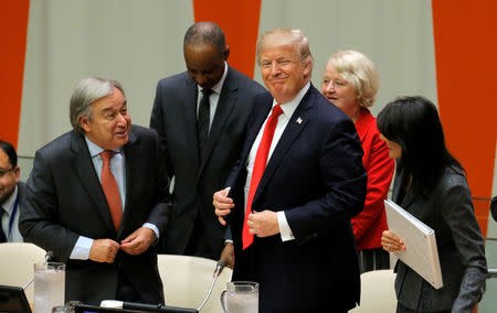 FILE PHOTO: U.N. Secretary General Antonio Guterres (L), U.S. President Donald Trump and U.S. Ambassador to the U.N. Nikki Haley stand following a session on reforming the United Nations at U.N. Headquarters in New York, U.S., September 18, 2017. REUTERS/Lucas Jackson/File Photo