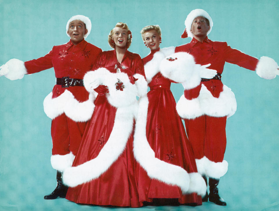 (Original Caption) Left to right are; Actor Bing Crosby, Actresses Rosemary Clooney and Vera Ellen, and Actor Danny Kaye, dressed in Christmas colors as they sing during the 1954 Paramount production of 'White Christmas.' Undated movie still. (Photo by George Rinhart/Corbis via Getty Images)