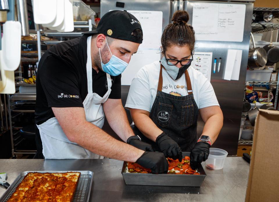 Brother and sister pizza-makers in Delray Beach: Koby Wexler (left) and Zoey Wexler prepare a Detroit-style pie during their Death by Pizza pop-up days in September 2020.