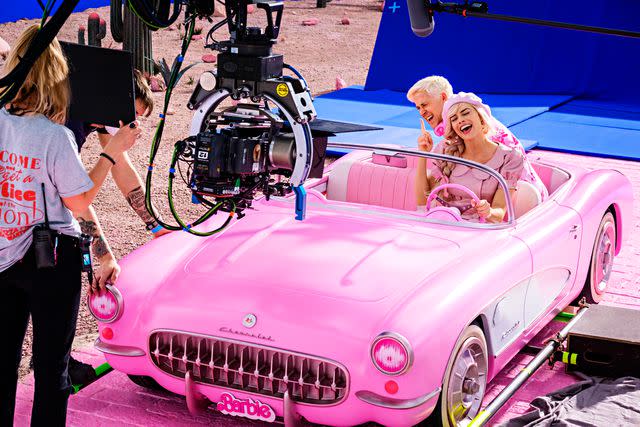 <p>Jaap Buitendijk/Warner Bros.</p> Ryan Gosling and Margot Robbie on the set of <em>Barbie</em> (2023)