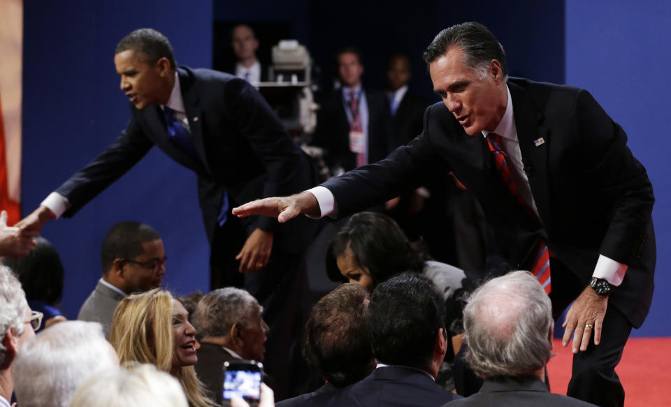 Republican presidential nominee Mitt Romney, right, and President Barack Obama shake hands with audience members following the third presidential debate at Lynn University, Monday, Oct. 22, 2012, in Boca Raton, Fla. (AP Photo/Eric Gay)