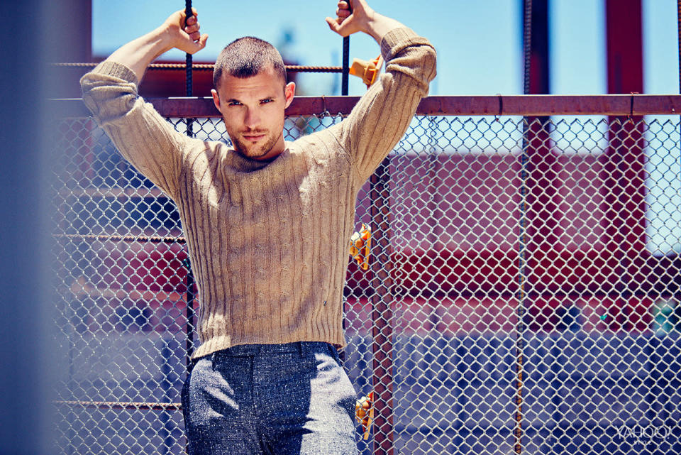 Ed Skrein in a lux Gucci cable knit sweater.