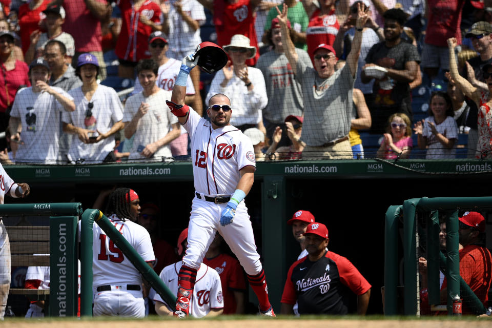 Washington Nationals' Kyle Schwarber takes a curtain call after he hit a two-run home run during the seventh inning of a baseball game against the New York Mets, Sunday, June 20, 2021, in Washington. (AP Photo/Nick Wass)