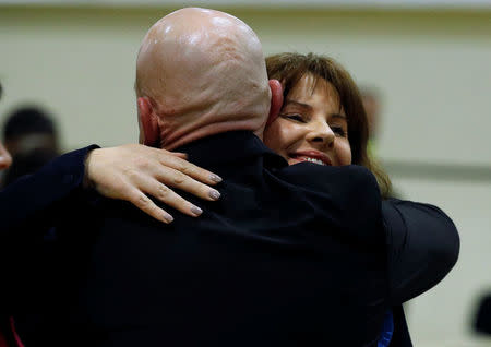 Conservative Party candidate Trudy Harrison embraces her husband Keith after winning the Copeland by-election in Whitehaven, Britain, February 24, 2017. REUTERS/Phil Noble