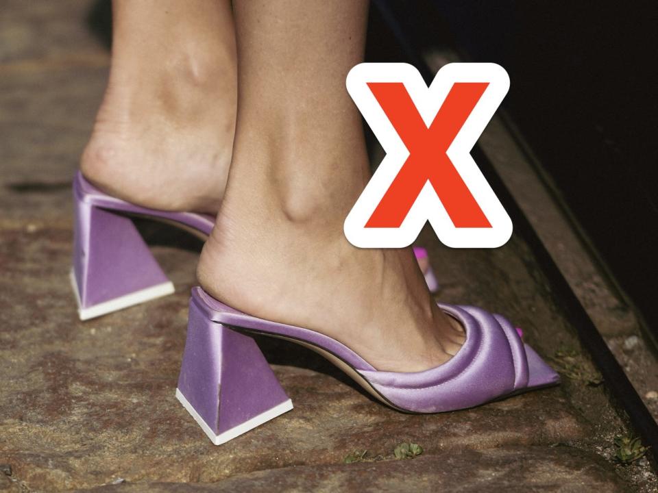 red x over someone wearing a pair of purple padded slide heels