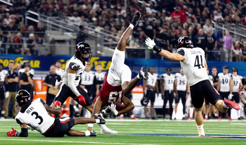 Cincinnati Bearcats safety Ja'von Hicks (3) tackles Alabama Crimson Tide tight end Jahleel Billingsley (19) in the second quarter the NCAA Playoff Semifinal at the Goodyear Cotton Bowl Classic on Friday, Dec. 31, 2021, at AT&T Stadium in Arlington, Texas. 