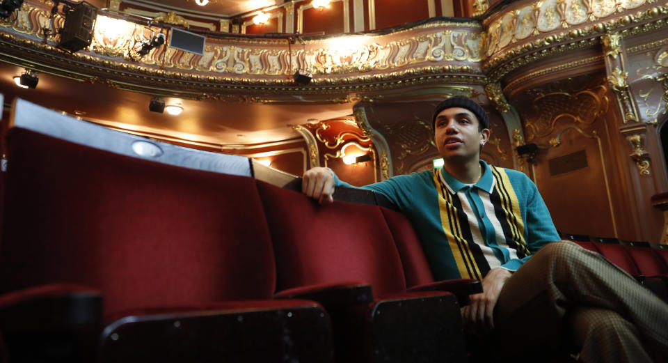 Leading actor of the musical "Everybody's Talking About Jamie', Noah Thomas who plays Jamie speaks to the Associated Press in the auditorium of the Apollo Theater where the musical is preparing to continue its run in London, Tuesday, April 20, 2021. (AP Photo/Alastair Grant)