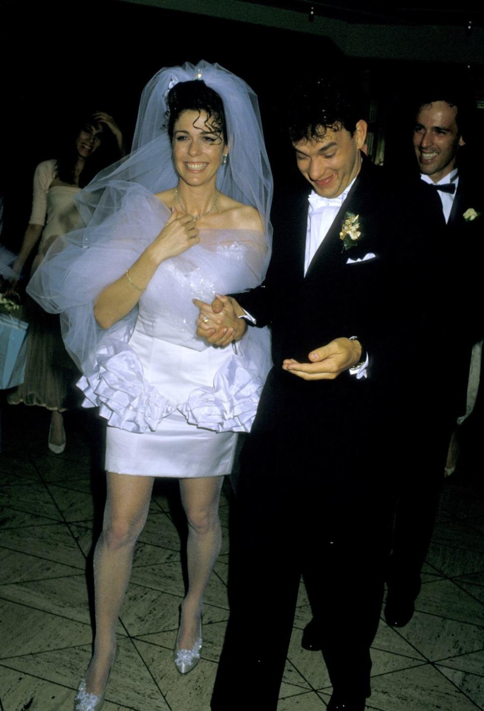 <p>Rita Wilson and Tom Hanks can barely contain their excitement after their Las Vegas nuptials in 1988. The couple met as costars in the 1984 film <em>Volunteers</em> and <a href="https://www.goodhousekeeping.com/life/entertainment/g3131/tom-hanks-rita-wilson-marriage" rel="nofollow noopener" target="_blank" data-ylk="slk:noticed an immediate spark;elm:context_link;itc:0;sec:content-canvas" class="link ">noticed an immediate spark</a>.</p>