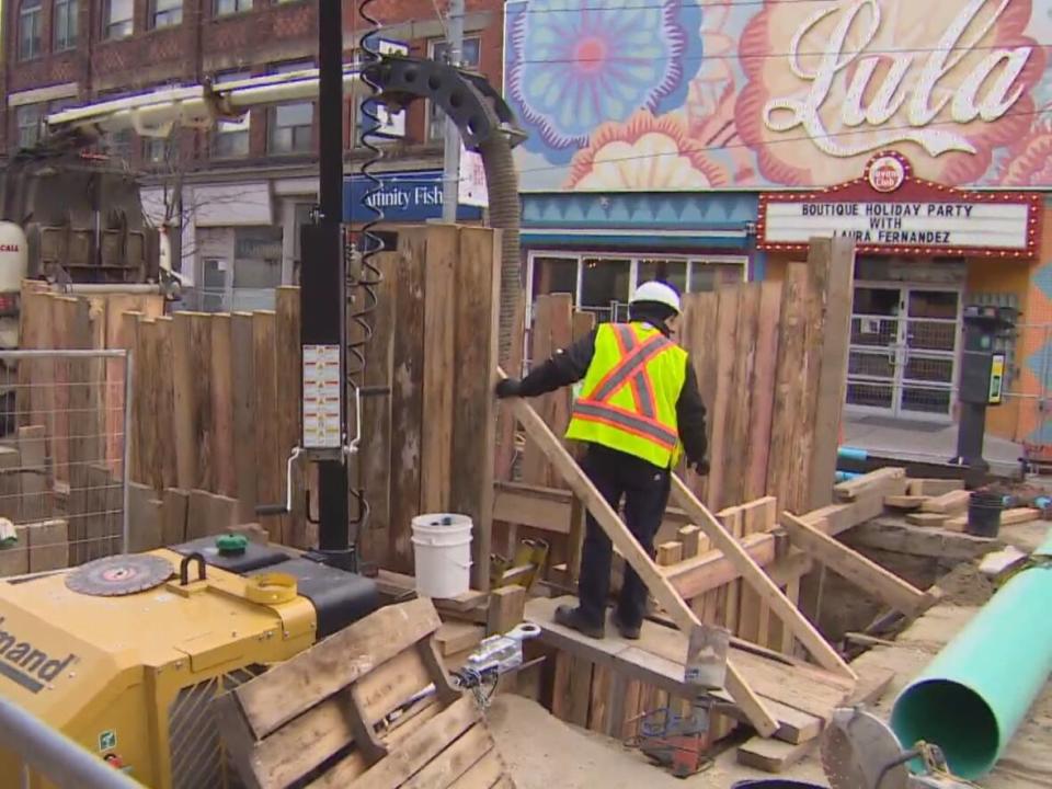 The city has closed a block of Dundas Street West to traffic from Brock and Sheridan avenues to fix a sewer main. The street is still accessible to pedestrians. Originally, the city said the road would be closed for a week but now it says it likely won't reopen until sometime in January. (CBC - image credit)