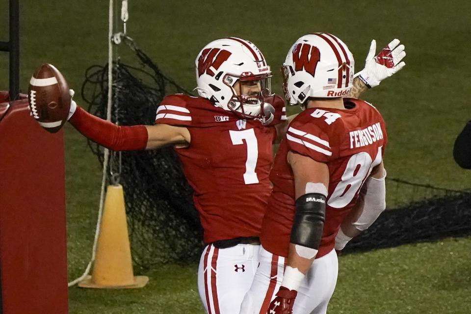 Wisconsin wide receiver Danny Davis III celebrates his touchdown catch with Jake Ferguson (84) during the first half of an NCAA college football game against Illinois Friday, Oct. 23, 2020, in Madison, Wis. (AP Photo/Morry Gash)