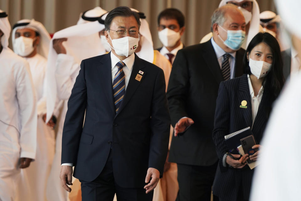 South Korean President Moon Jae-in leaves an event at Abu Dhabi Sustainability Week at Dubai Expo 2020 in Dubai, United Arab Emirates, Monday, Jan. 17, 2022. The president of South Korea on Monday vowed to world leaders that his fossil fuel-dependent country and the oil-rich United Arab Emirates would jointly expand their investments in renewable energy to tackle climate change. (AP Photo/Jon Gambrell)