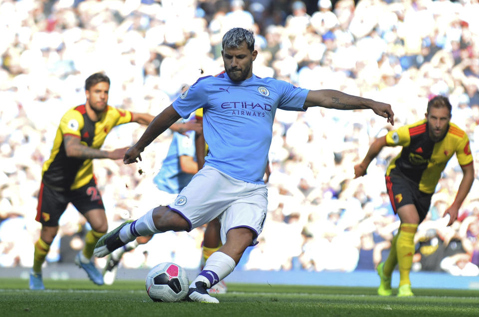 Manchester City's Sergio Aguero scores his sides second goal from a penalty spot during the English Premier League soccer match between Manchester City and Watford at Etihad stadium in Manchester, England, Saturday, Sept. 21, 2019. (AP Photo/Rui Vieira)