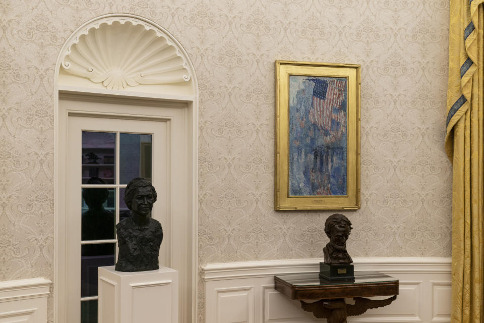 The Oval Office of the White House is newly redecorated for the first day of President Joe Biden's administration, including busts of civil rights leader Rosa Parks, left, and President Abraham Lincoln, Wednesday, Jan. 20, 2021, in Washington. (AP Photo/Alex Brandon)