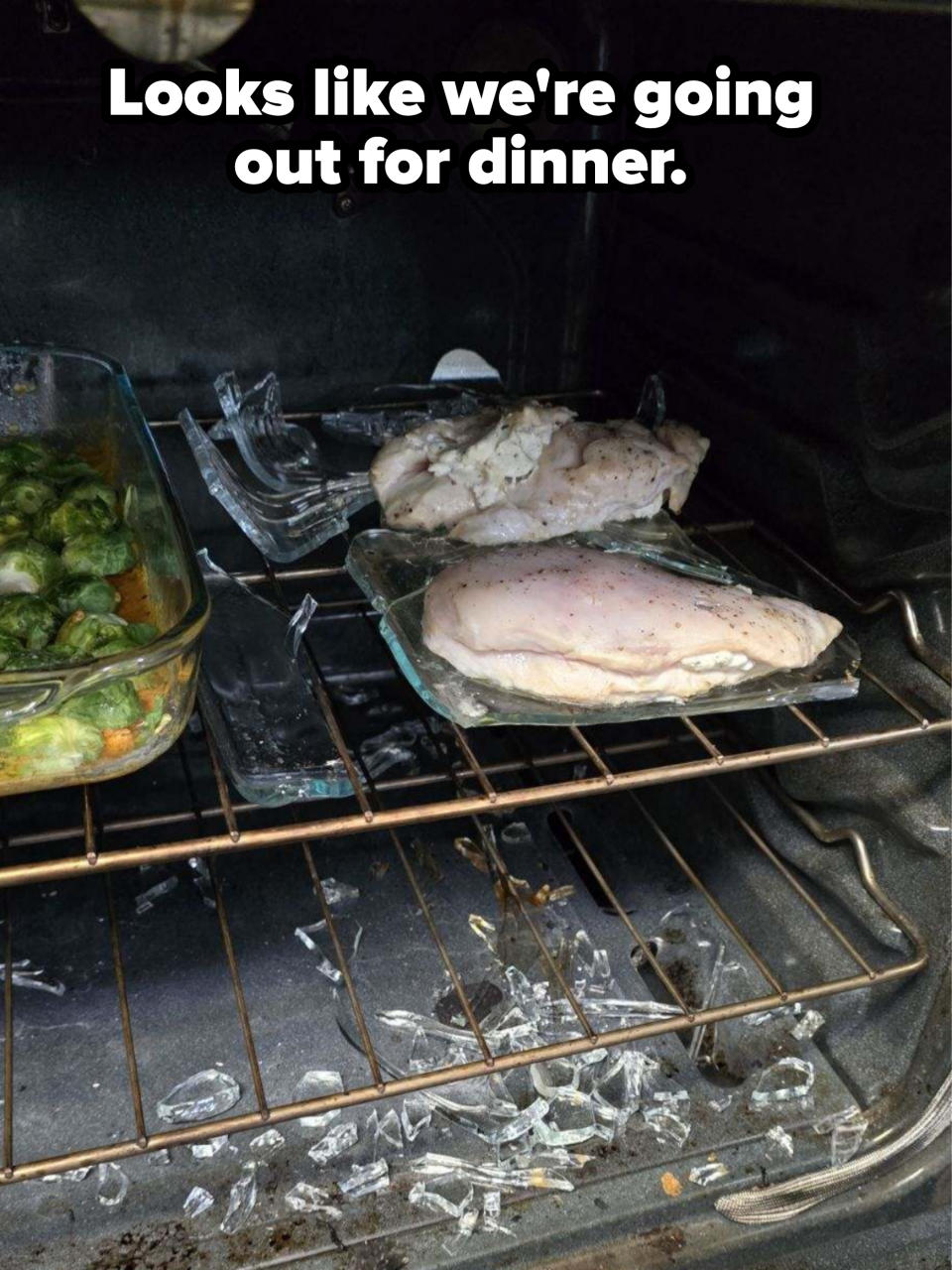 Chicken and vegetables in an oven with broken glass dish