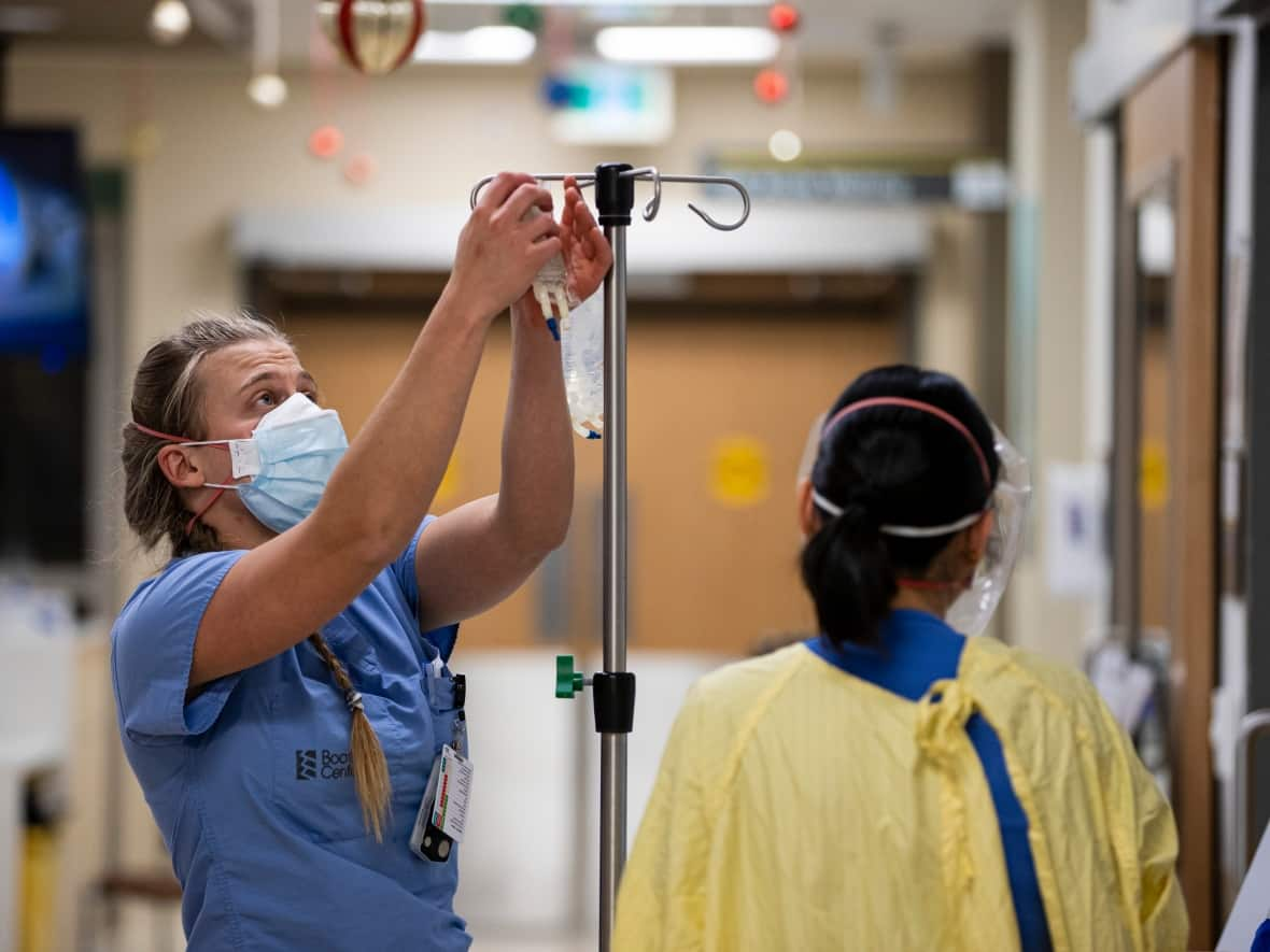 A nurse prepares to help a patient in an Ontario emergency room. (Evan Mitsui/CBC - image credit)