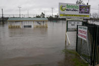 This photos shows a flooded sports venue in Camden on the outskirts of Sydney, Australia, Monday, July 4, 2022. More than 30,000 residents of Sydney and its surrounds have been told to evacuate or prepare to abandon their homes on Monday as Australia’s largest city braces for what could be its worst flooding in 18 months. (AP Photo/Mark Baker)