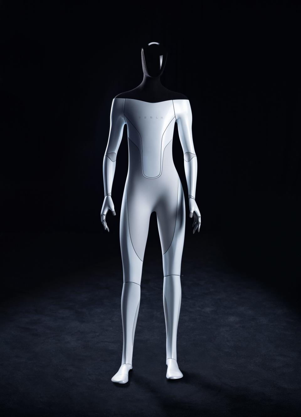 A full body rendering of a Tesla Bot with a blank black head and a shiny white body