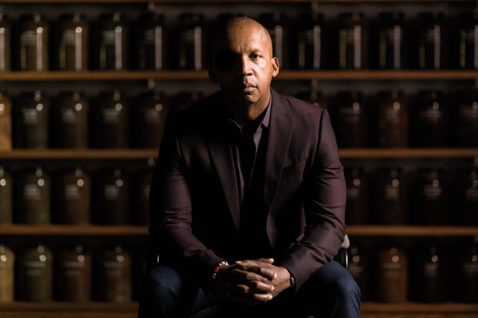 Bryan Stevenson sits in front of a wall of jars filled with soil collected from lynching sites across the country. The jars are located inside the Equal Justice Initiative's museum opened last year in Alabama, alongside its National Memorial for Peace and Justice, dedicated to the thousands of lynching victims in the U.S. (Photo: Nick Frontiero / Courtesy of HBO)