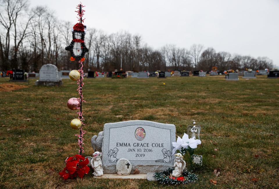 The gravesite of Emma Grace Cole, located inside the Clear Creek Cemetery in Bloomington, Ind., on Tuesday, Dec. 7, 2021. The site was decorated for the holidays by Cole's great aunt, Tanya Stroud, whom Cole's mother, Kristie Cole Haas, had voluntarily given guardianship to in May 2016.
