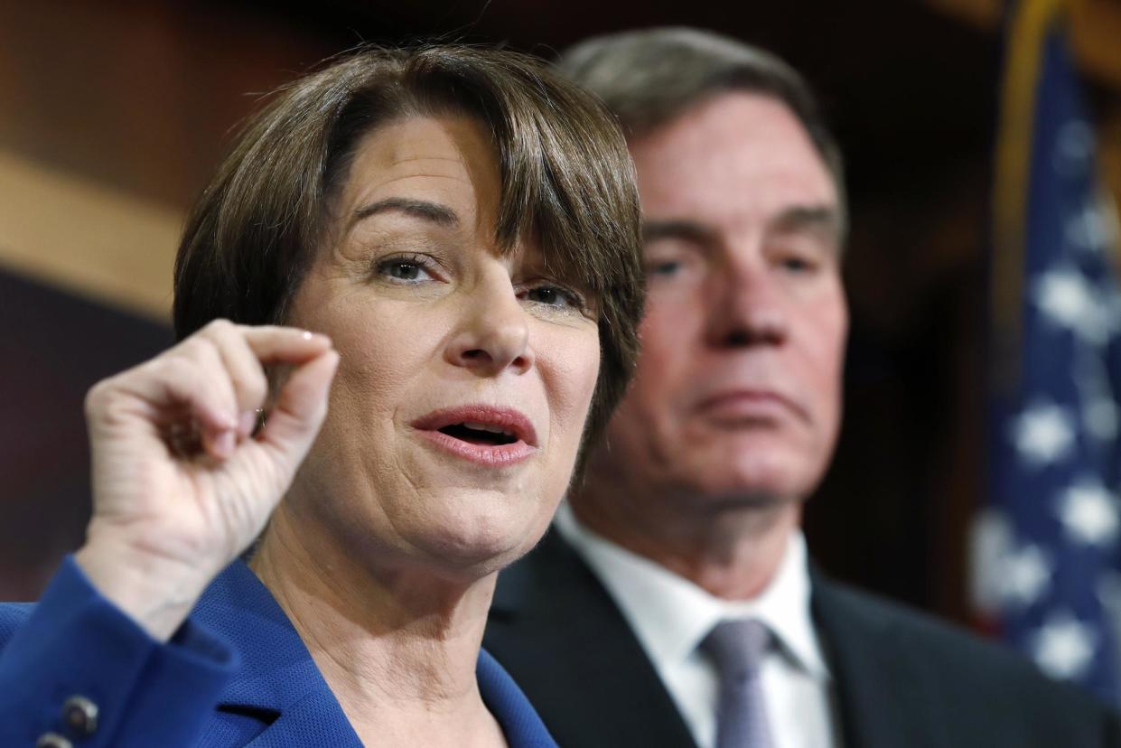 Senator Amy Klobuchar, D-Minn., left, and Senator Mark Warner, D-Va., speak about online political ads and preventing foreign interference in U.S. elections, during a news conference: AP