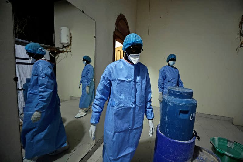 Professor Moussa Seydi, wearing his personal protective equipment (PPE) walks out after meeting his patients suffering from the coronavirus disease (COVID-19) at the infectious diseases department of the University Hospital Fann, in Dakar