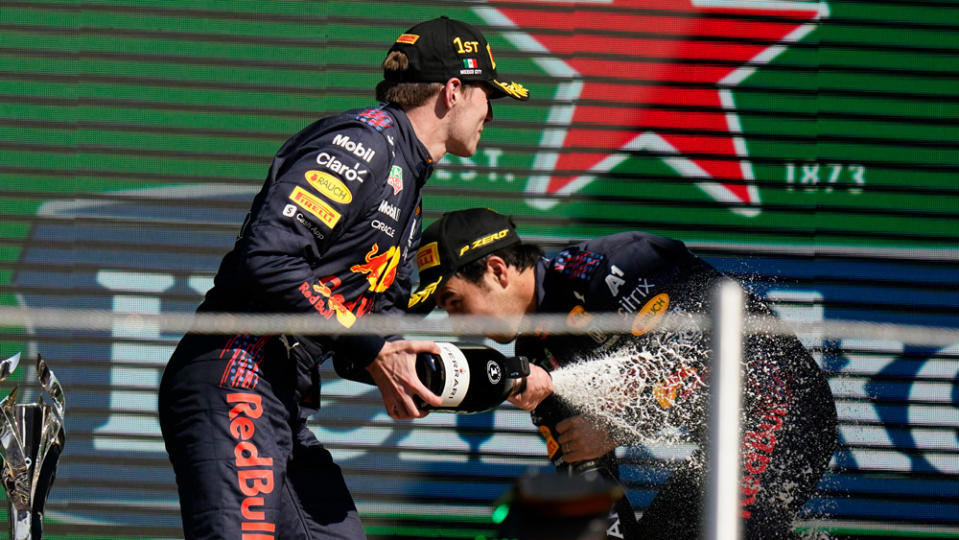 Winning driver Max Verstappen celebrates with Sergio Perez after the race. - Credit: Photo by AP Photo/Eduardo Verdugo.