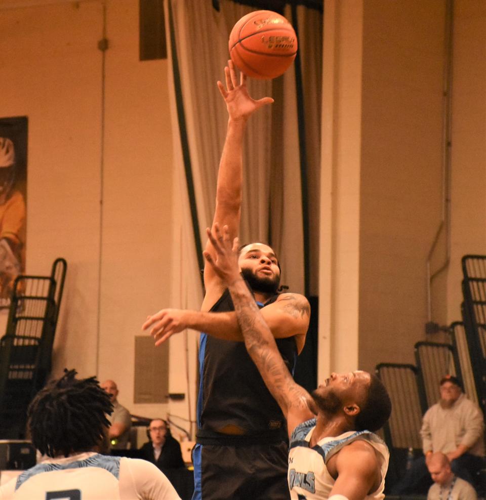 Savier McCall puts up a shot for Riverland Community College Wednesday during a first round NJCAA tournament game against Prince George's Community College.