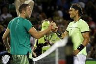 Mar 29, 2017; Miami, FL, USA; Rafael Nadal of Spain (R) shakes hands with Jack Sock of the United States (L) after their match on day nine of the 2017 Miami Open at Crandon Park Tennis Center. Nadal won 6-2, 6-3. Mandatory Credit: Geoff Burke-USA TODAY Sports