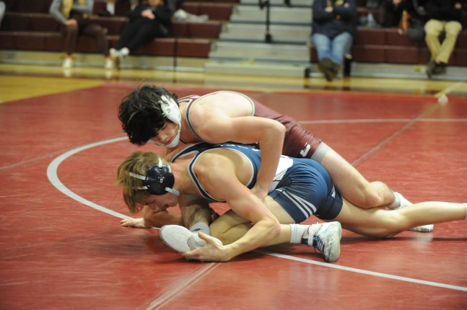 State College’s James Whitbred controls Cedar Cliff’s Zach Cutshall in their 139-pound bout of the Little Lions’ 34-32 win on Thursday at State College. Whitbred racked up a 12-4 major decision on Cutshall.