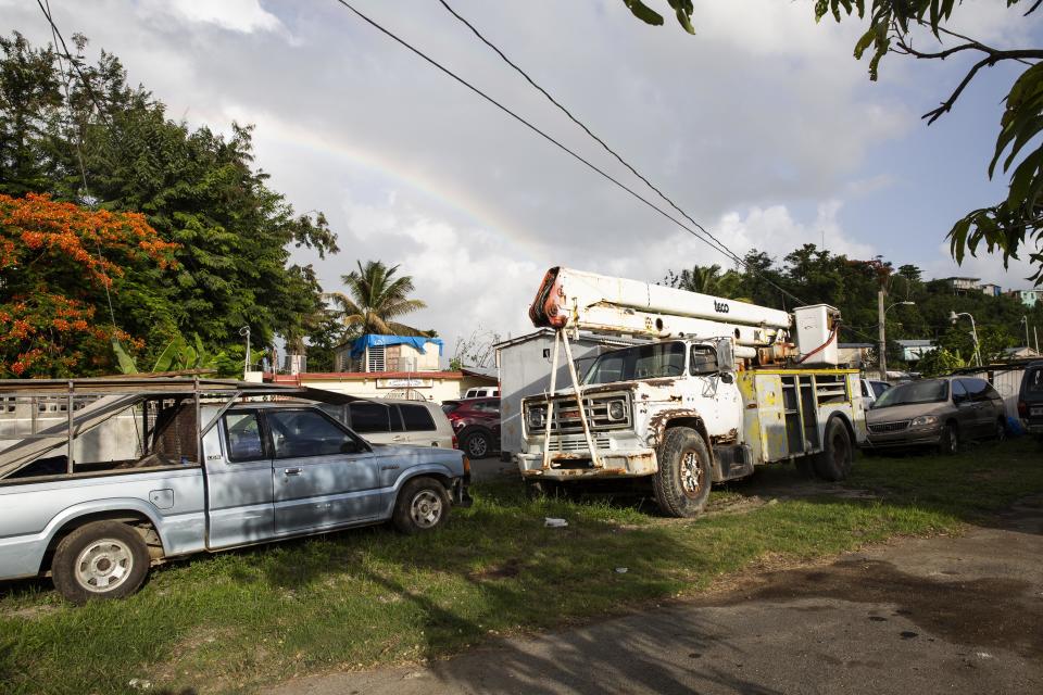 Carrion raised $2,500 from local residents and bought a used bucket truck (right), with which he and others repaired power lines. (Photo: Carolina Moreno/HuffPost)