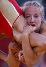 Sweden's Sofia Mattsson (in blue) fights with Russia's Valeriia Zholobova on the Women's 55Kg Freestyle wrestling at the ExCel venue during the London 2012 Olympic Games August 9, 2012. REUTERS/Suhaib Salem (BRITAIN - Tags: OLYMPICS SPORT WRESTLING) 