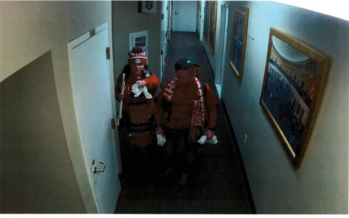Scott Christensen (right) and his wife, Holly Christensen, of Puyallup, are seen on surveillance footage Jan. 6, 2021 in a fourth-floor hallway on the Senate side of the U.S. Capitol building, according to a criminal complaint filed in U.S. District Court for the District of Columbia.