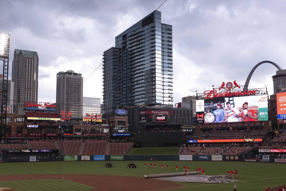 Busch Stadium is viewed as the field crew puts on the tarp during a rain delay in a baseball game between the Pittsburgh Pirates and the St. Louis Cardinals Sunday, June 27, 2021, in St. Louis. (AP Photo/Joe Puetz)